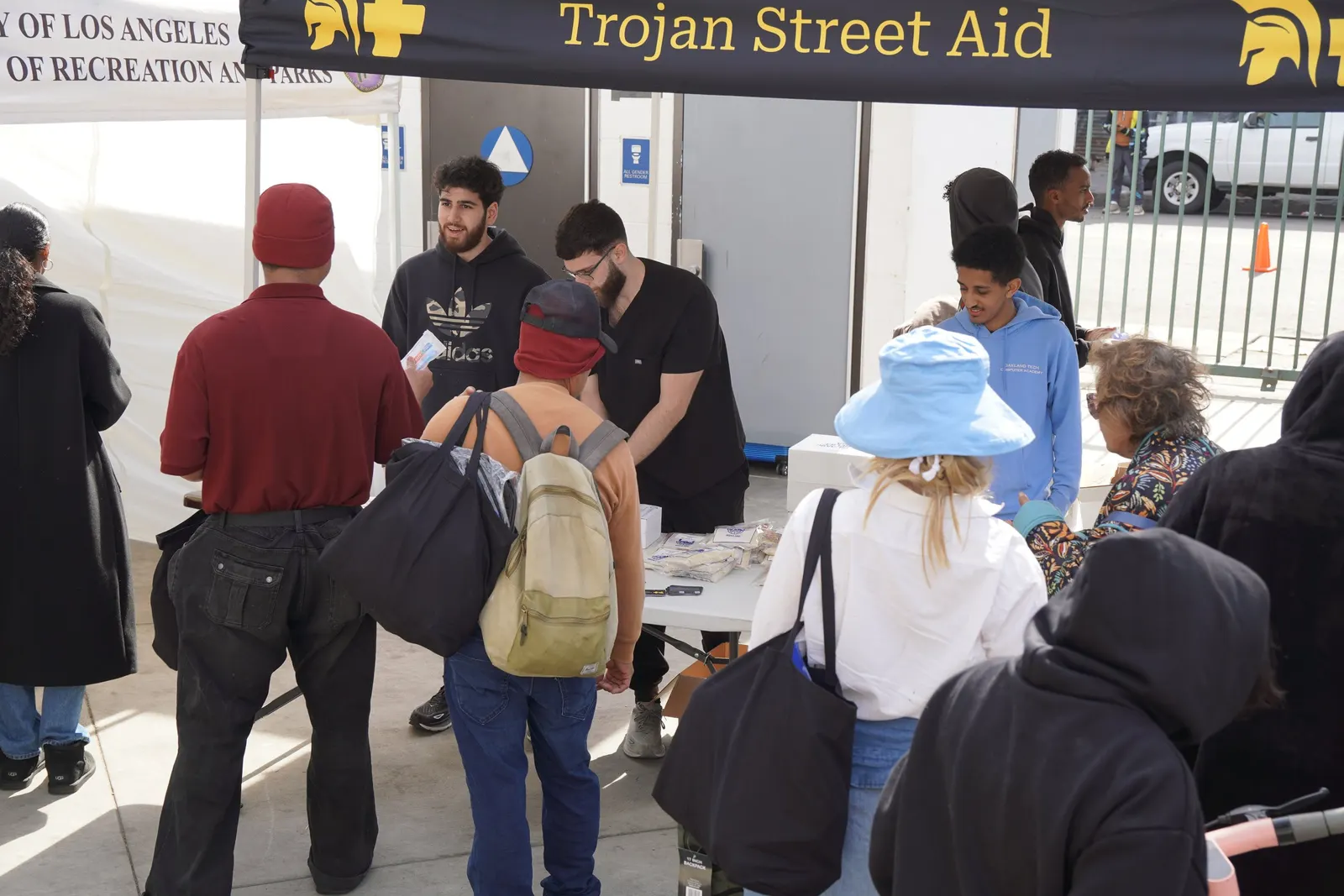 Volunteers handing out meals and hygiene kits